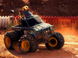Stylized RC monster truck with a pigeon on a dirt race track